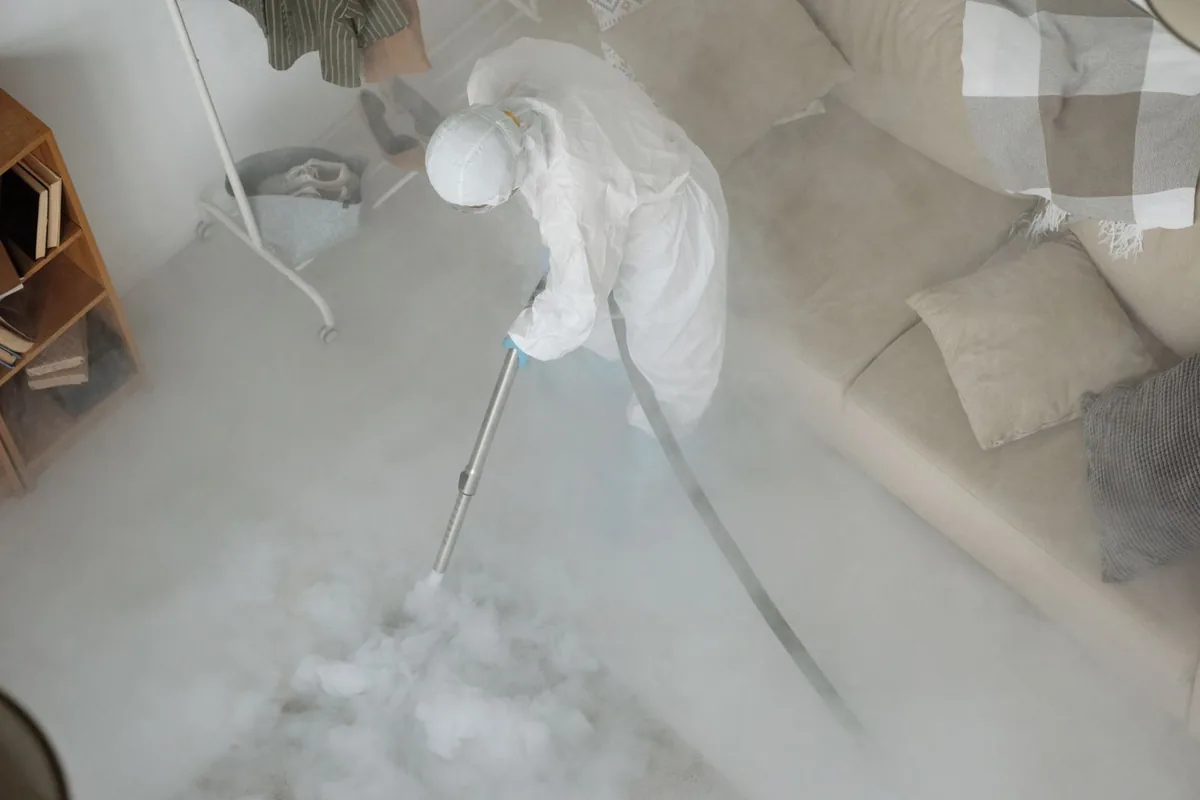 Biohazard cleanup technician in protective equipment, Saukville, WI